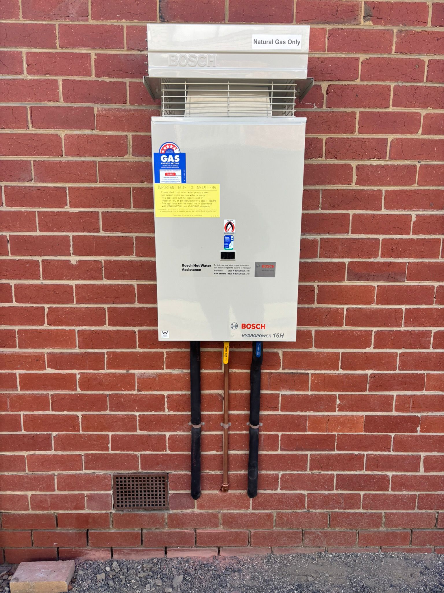 Bosch gas hot water system installed on exterior brick wall Templestowe Melbourne